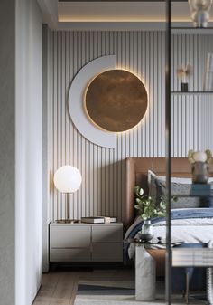 a bed room with a neatly made bed and a round mirror on the wall above it