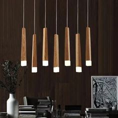 modern wooden pendant lights hanging from the ceiling