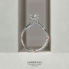 an engagement ring in a box with diamonds