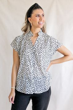 The Sofia blouse features a flowy button-up style with a feminine ruffle collar. Just unbutton the first few buttons, and you've got easy nursing access. For a cropped look, tie the bottom into a knot. Cut from airy cotton, this black and white printed blouse features pretty abstract flowers. A customer's print favorite: available in the Gaelle Wrap Blouse. Start tab labels Size Guide Details Shipping Start tab content XS - (0) | Bust 32-33 | Waist 24-26 | Hip 34-35 S - (2-4) | Bust 34-35 | Wais Versatile Spring Blouse With Button Closure, Spring Tie Neck Top With Button Closure, Effortless Rayon Blouse For Spring, Spring Tie-neck Top With Button Closure, Effortless Spring Rayon Blouse, Spring Tie Neck Tops With Button Closure, Spring Rayon Blouse With Buttons, Collared Rayon Tops For Spring, Versatile Collared Blouse For Spring