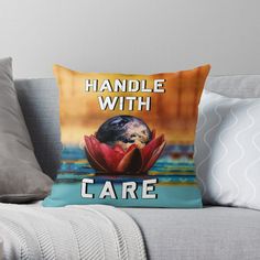 a pillow that says handle with care on it