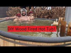 a man and two boys in a hot tub with the words diy wood fired hot tub