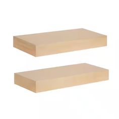 two pieces of wood sitting on top of each other