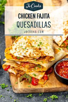 chicken fajita quesadillas stacked on a cutting board with salsa in the background