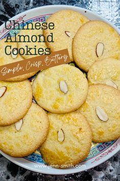 cookies with almonds are arranged in a bowl on a table top and the words, chinese almond cookies simply crisp, buttery