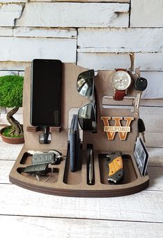 an assortment of office supplies on a wooden tray