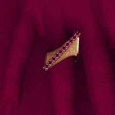 Discover the elegance of Italian craftsmanship with our Modern Twisted Gold Ring, featuring a sophisticated design and exquisite attention to detail. Created by Oltremare Gioielli, this luxurious ring showcases a beautifully crafted twist with polished edges and earth-textured surfaces, embodying both modern style and timeless elegance. The top ridge is adorned with 10 round, natural rubies (2.8mm each, approximately 0.82 carats), adding a touch of vibrant color and brilliance. Handcrafted in It Luxury Marquise Ruby Ring, Luxury Polished Finish Ruby Ring For Formal Occasions, Luxury 14k Gold Ruby Ring, Luxury Ruby Gemstone Ring, Elegant Ruby Jewelry With Polished Finish, Elegant Ruby Ring With Diamond And Polished Finish, Exquisite Gold Rings For Evening, Elegant Open Band Diamond Ring With Polished Finish, Timeless Diamond Cut Rings For Evening