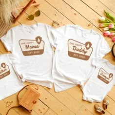 three t - shirts with the words one happy mama and two baby ones on them