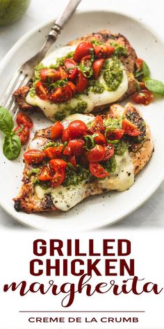 grilled chicken with tomatoes and pesto served on a white plate