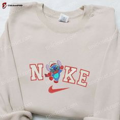 Introducing the Nike Christmas x Stitch Hey Embroidered Sweatshirt! This festive collaboration with Disney brings together the iconic Nike style and the beloved character Stitch. The sweatshirt features a beautifully embroidered design of Stitch saying “Hey” in a Santa hat, adding a touch of holiday cheer to any outfit. Made from high-quality materials, it offers [...] Nike Christmas, Nike Cartoon, Nike Hoodies, 80s Outfits, Embroidered Apparel, Disney Christmas Shirts, Duck Gifts, Disney Sweater, Sneaker Heads