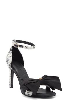 Every step will shimmer and shine in this party-ready sandal that's sweetened with a rhinestone-adorned bow. 4" heel Textile upper and lining/rubber sole Imported Bow Sandals, Karl Lagerfeld Paris, Rhinestone Bow, Flat Sandals, Karl Lagerfeld, Women's Shoes Sandals, Shoes Sandals, Womens Sandals, White And Black