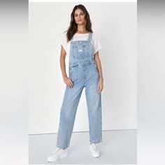 Levi’s Denim Overalls In Light Blue In Good Pre-Owned Condition Size Medium Casual Denim Blue Jean Overalls, Casual Denim Blue Overall Jeans, Casual Dark Wash Mid-rise Denim Jumpsuit, Casual Light Wash Overall Jeans, Casual Mid-rise Dark Wash Denim Jumpsuit, Casual Light Wash High Rise Denim Jumpsuit, Casual High Rise Light Wash Denim Jumpsuit, Casual High Rise Washed Denim Jumpsuit, Levi's Casual Cotton Jeans