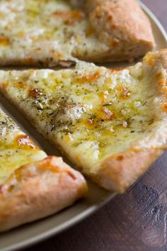 slices of pizza sitting on top of a white plate