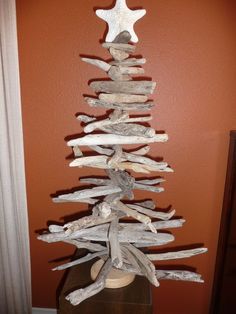 a christmas tree made out of drift wood