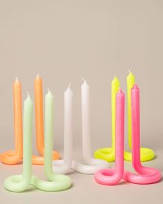 five candles are lined up in different colors