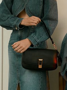 Editor's NoteJOY GRYSON's bags can be matched for various formal and casual stylings. - Over sized shoulder clip decoration- Detachable short strap- Magnetic closure detail- Open pocket at back Measurements (in.)- Size: 10.63 in. * 6.30 in. * 2.56 in.- Strap: 33.86 in. ~ 43.31 in. Composition & Care- Upper: Cowhide, Lining: Twill Cotton- Avoid direct heat and moisture- Wipe moisture with a dry clothDesigner- by JOY GRYSON Black Shoulder Bag With Fold Over Clasp For Business, Elegant Workwear Bag With Fold Over Clasp, Chic Black Baguette Bag With Metal Hardware, Chic Formal Baguette Bag With Metal Hardware, Formal Black Baguette Bag With Metal Hardware, Square Shoulder Bag With Detachable Strap For Work, Chic Satchel With Hasp Closure And Clutch Shape, Modern Evening Flap Bag With Hasp Closure, Elegant Top Handle Baguette Bag For Work