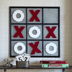 a close up of a table with two boxes on top of it and a game board in the background