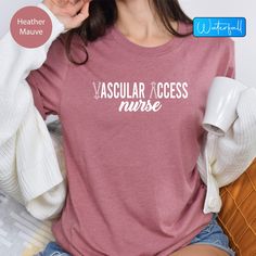 Vascular Access Nurse Tshirt, Vascular Nurse Shirt, Vat Team Shirt, Vascular Nurse Gift, Vat Team Nurse Appreciation Shirt, Nurse Life Tee  Show your pride and dedication with our "Vascular Access Nurse" tshirt! Designed specifically for vascular access nurses and VAT team members, this shirt is perfect for celebrating your vital role in healthcare.  Whether you're looking for a way to express your passion for your profession or seeking a thoughtful gift for a fellow nurse, this comfortable and Casual Pink Nursing Tops, Cotton Nursing Shirt With Crew Neck, Pre-shrunk Crew Neck Nursing Shirt, Nursing Tops With Text Print And Crew Neck, Crew Neck Nursing Tops With Text Print, Casual Nursing Shirt With Crew Neck, Casual Nursing Top With Crew Neck, Nurse Team, Nurse Tshirt