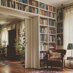 a living room filled with lots of books