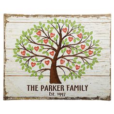 the parker family tree is painted on a white wooden sign with red and green hearts