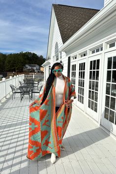 Rich Auntie at it's finest! Our fashion winter long hooded kimono is a fun, colorful and flowy kimono. Open front styling , bold print and hood makes this a statement piece you will want in your closet. One Size fits up to 4X as the sleeves are open flowy and the poncho has an open front. Styling tip: Can be worn over jeans, boots, dresses, or on it's own! Easy transition piece for a coat! Styling options are endless! Fabric composition is tencil wool polyester blend for a flowy fit. Fabric is n Casual Orange Long Sleeve Kimono, Long Bohemian Orange Kimono, Vacation Long Sleeve One-size Kimono, Spring Poncho With Kimono Sleeves, Oversized, Hooded Kimono, Boots Dresses, One-size Long-sleeve Acrylic Poncho, Coat Styling, Open Front Poncho