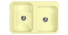 a yellow sink with two faucets in it