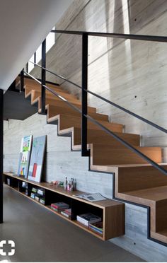 the stairs in this modern house are made from wood and steel