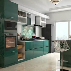 a modern kitchen with green cabinets and stainless steel appliances