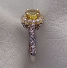 "Our family has been in the fine jewelry business for 3 generations. We designed and handmade this ring. The center is a beautiful 5.8 mm round Yellow Sapphire 1.16Cts VS clarity. Two photos show the loose stone that we will be using. The Sapphire is absolutely stunning. With 28 halo and side diamonds .30 Cts t/w. It is made in 18k white and yellow gold. We can make it any size from 5-7 and you still be able to return it within the listed time frame. Sizing outside of that range requires a re-si Diamond Halo Engagement Ring, Halo Diamond Engagement Ring, Yellow Sapphire, Jewelry Business, Diamond Halo, Halo Engagement Ring, Halo Engagement, Antique Style, Halo Diamond