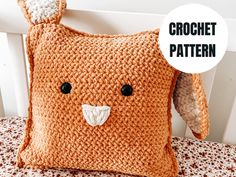 an orange crocheted pillow with a bunny face on it's side and the words crochet pattern below