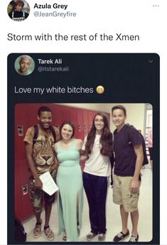 some people are standing together in front of lockers and one person is holding an envelope