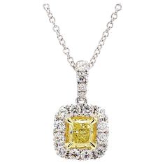 RareGemWorld's intriguing GIA certified diamond pendant. Mounted in a beautiful 18K Yellow and White Gold setting with a natural radiant cut yellow diamond. The yellow diamond is surrounded by round natural white diamond melee. This pendant is guaranteed to impress and enhance your personal collection. Total Weight: 0.74cts Natural Fancy Yellow Radiant Cut Diamond Measurements: 4.28 x 3.64 x 2.75 mm Weight: 0.43cts Clarity: VS1 Natural Round White Diamonds 18K Yellow/White Gold All diamonds are guaranteed natural International Shipments: Please note that customers are responsible for all import duties and taxes applicable to the country of shipment Returns: Returns accepted in original format within 14 days of receipt Do not forget to view our entire inventory! Thank you for reviewing our White Gold Set, Radiant Cut Diamond, Radiant Diamond, Yellow Diamond, Gia Certified Diamonds, Drop Pendant, Diamond Pendant, White Diamond, Diamond White