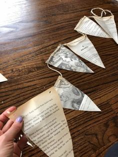 someone is making some paper airplanes out of old book pages