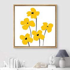 some yellow flowers on a white wall