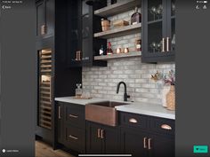 a kitchen with black cabinets and white counter tops, an open wine rack in the corner