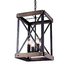 a light hanging from the ceiling with three candles in it's caged frame