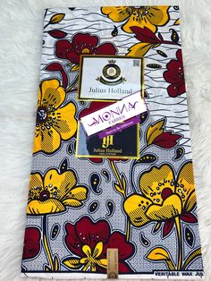 Exclusive African Wax Print by Julius Holland: Premium 100% Cotton Ankara Fabric Product Highlights: Type: African Wax Print / Julius Holland Print / 100% Cotton / Ankara Fabric Quality: High Quality Dimensions: 6 Yards (216 inches / 548 cm) in Length, 46 inches (116.84 cm) in Width Colors: Navy blue, yellow, wine and white Product Description: Experience the vibrant and rich culture of Africa with our exclusive Julius Holland African Wax Print. Crafted from 100% premium cotton, this Ankara fabric boasts a luxurious waxed texture, perfect for a variety of uses. Whether you're preparing for a traditional wedding, an African ceremony, or simply looking to add an exotic touch to your fashion designs, this fabric is your ideal choice. Versatile Uses: - Traditional wedding attire - African casu Traditional Wedding Attire, White Product, African Wax Print, Ankara Fabric, Fashion Designs, Wax Print, Wedding Attire, Traditional Wedding, Ankara