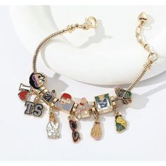 Show Off Your Love For Taylor Swift With This Beautiful Charm Bracelet. Featuring The Iconic "I Taylor Swift 1989" Design, This Bracelet Is Perfect For Any True Fan. The Gold Color And Charm Style Make It A Great Addition To Any Jewelry Collection. This Taylor Swift Charm Bracelet Is Brand New With Tags And Comes With Free Shipping. It Is A Must-Have For Any Fashion-Forward Fan Looking To Add A Touch Of Taylor Swift To Their Style. Buy Now And Show Your Love For The Queen Of Pop Music! Taylor Swift Charms, Taylor Swift Charm Bracelet, Taylor Swift Pandora Charms, Adjustable Silver Bracelet With Logo Charm, Trendy Metal Bracelets With Logo Charm, Casual Silver Metal Charm Bracelet, Casual Metal Charm Bracelet As Gift, Casual Metal Charm Bracelet Gift, Casual Metal Charm Bracelet For Gift