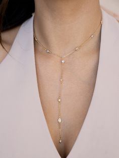 Materials: 18kt Gold Plated, Cubic ZirconiaLength: 14" & 5" drop with 5" extenderChain Width: 1mmClosure: Lobster Clasp Party Lariat Necklace With Adjustable Cubic Zirconia Chain, Delicate Lariat Cubic Zirconia Necklace, Delicate Cubic Zirconia Lariat Necklace, Gold Lariat Cubic Zirconia Diamond Necklace, Gold Cubic Zirconia Lariat Backdrop Necklace, Gold Cubic Zirconia Lariat Diamond Necklace, Gold Cubic Zirconia Lariat Necklace, Gold Lariat Diamond Necklace With Cubic Zirconia, Dainty Cubic Zirconia Lariat Jewelry