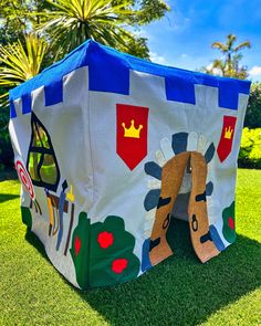 a child's play tent in the grass