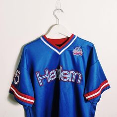 a baseball jersey hanging on a hanger with the name halen written on it