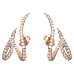 Sparkle all way with these beautiful Messika Gatsby Daisy diamond earrings. Crafted in fine 18K rose gold. These earrings feature pave set round brilliant cut diamonds weighing 0.97 carat. Diamond color G and clarity VS. Total weight: 5.05 grams. Secured with push back. A part of the earring is positioned on the lobe while the other wraps the ear below. The luminescent white gold enlightens the diamond's purity, enhancing its beautiful radiance. Comes with the original box and paper. Free Sign, Fine Jewellery Earrings, Round Brilliant Cut Diamond, Gatsby, 18k Rose Gold, Jewelry Earrings Studs, Round Brilliant, Jewelry Inspiration, Or Rose