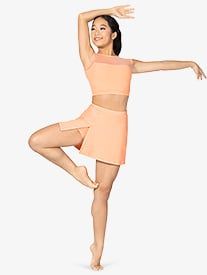 a woman in a short skirt and top doing a dance pose with her arms outstretched