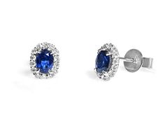 Oval shape blue sapphires and diamond stud earrings are a thing of beauty made in 18K white gold and set with 28 round diamonds these earrings are dainty and elegant. Stud earrings are a must-have for every women's jewelry collection, so we think that you should snag a set for yourself, as well as a pair for a love one in your life. They make for a wonderful gift giving option.Metal: 18KT White GoldDiamond Weight:(28) 0.27ctwCenter Stones (2): SapphiresSapphires Weight: 1.02ct t.wEarring Length: Sapphire Stud Earrings, Blue Sapphire Studs, Sapphire Earrings Studs, A Thing Of Beauty, Sapphire Studs, Diamond Stud Earrings, Diamond Stud, Diamond Earrings Studs, Diamond Studs