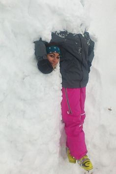 a person laying down in the snow