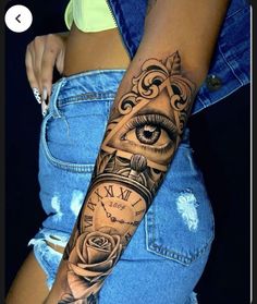 a woman's arm with an eye and clock tattoo on the left side of her body