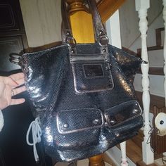 I Have A Silver/Chrome Color Sequin Coach Poppy Bag In Excellent Condition, Barely Used. Any Redish Color In Photos Is Only A Reflection From My Light . It Has A Lot Of Room And A Lot Of Pockets, It Is A Light Purple Color Inside. It Is A Nice Size Bag As You Can See From The Picture With My Hand In It. The Silver Buttons On The Front Pockets,Have The Word Coach On Them As Well. These Bags A Quite Hard To Find In Great Condition And I've Seen Some Pretty Expensive Ones, But I Was Lucky Enough To Metallic Tote Shoulder Bag With Silver-tone Hardware, Silver Bag With Removable Pouch For Shopping, Silver Shoulder Bag With Removable Pouch And Double Handle, Designer Silver Tote Bag, Designer Silver Shoulder Bag With Dust Bag, Silver Designer Bag With Double Handle, Designer Silver Shoulder Bag With Double Handle, Metallic Shoulder Bag With Silver-tone Hardware For Shopping, Designer Silver Bag With Detachable Strap