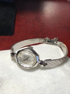 Excellent working and very good cosmetic condition. Comes with a white gold filled top and stainless steel bottom band. Fits a 5 3/4 inch wrist. Case size measures 16mm. 90 day money back guarantee, no questions asked, and 2-year warranty on our service. Silver Automatic Watch For Wedding, Silver Automatic Watches For Wedding, Antique White Gold Watch With Polished Finish, Antique White Gold Watches With Polished Finish, White Gold Diamond Watch With Chronometer For Anniversary, Vintage White Round Watches, Silver Chronometer Watch With Round Dial, Silver Chronometer Watch For Anniversary, Silver Anniversary Watch With Chronometer