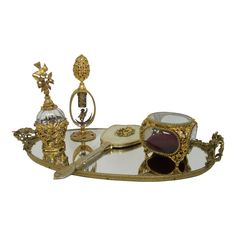 an ornately decorated tray with various items on it