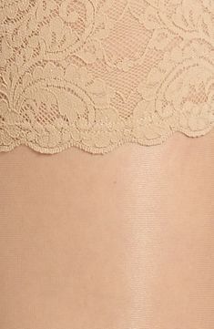 These smooth, soft stockings have a sophisticated matte finish and stay put with grippy lace bands. 87% polyamide, 13% elastane Machine wash cold, line dry Made in Austria Hosiery Stretch Lace Stockings With Lace Trim, Elegant Stretch Stockings With Lace Trim, Elegant Stretch Lace Trim Hosiery, Elegant Stretch Legwear With Lace Trim, Stretch Legwear For Formal Occasions, Elegant Fitted Hosiery With Lace Trim, Elegant Beige Micro-elastic Hosiery, Elegant Stretch Lace Bottoms, Elegant Stretch Lace Legwear